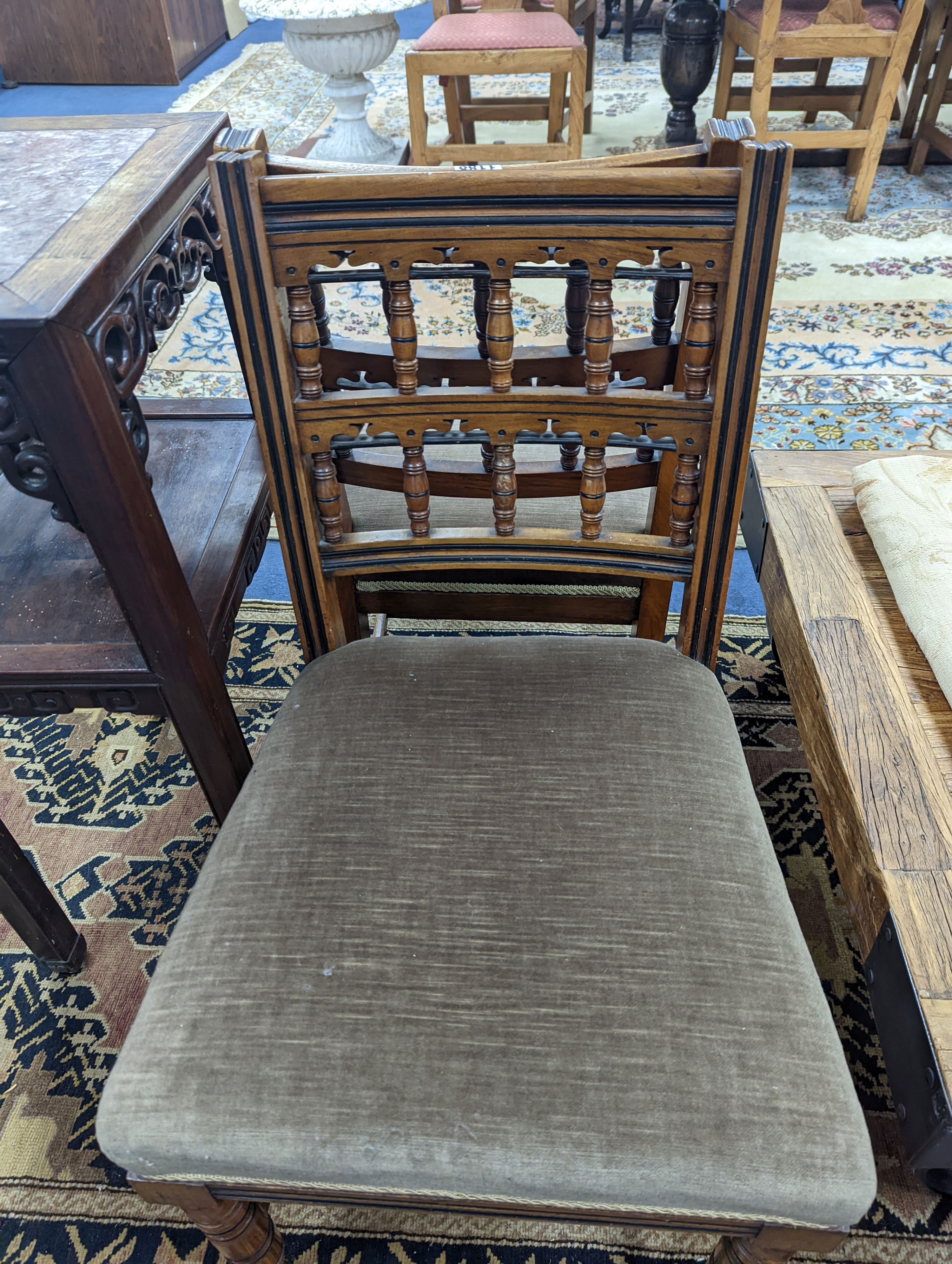Bruce James Talbert (1838-1881) for James Lamb, Manchester, a pair of Aesthetic movement walnut side chairs, width 44cm, depth 48cm, height 82.5cm